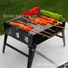 En stock Venta al por mayor Parrilla de carbón conveniente para exteriores Parrilla plegable pequeña de acero negro Parrilla de carbón para el hogar Parrilla pequeña de acero negro