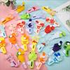 Mini ventilador de mano portátil de verano para estudiantes y niños, con dibujos animados, a presión, pequeño regalo, juguete al por mayor