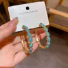 Aretes retro estilo francés en turquesa y perla, un diseño de nicho y versátil con un toque de lujo, al por mayor