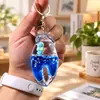 Llavero Creativo Portátil con Colgante Líquido del Mundo Marino, Juguete Delfín de Arena Movediza para Alivio del Estrés, Regalo de Cumpleaños
