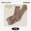 Calcetines para mujer para otoño e invierno, con un estilo retro de color jaspeado, longitud hasta la pantorrilla, borde de encaje de burbujas, diseño de lunares y un dobladillo con volantes. Calcetines de algodón al por mayor
