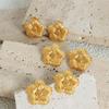 Aretes al por mayor caen en el patrón mundial textura de girasol aretes de acero de titanio mini aretes pequeños exquisitos