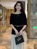 Top de camiseta elegante de manga corta estilo coreano de una sola pieza para mujer, top de diseño de verano, conjunto de dos piezas con falda midi plisada