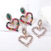 Moda europea y americana exagerada personalidad moderna creativa aleación diamante color amor clip para la oreja en forma de corazón aretes colgantes grandes para mujer