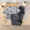 Conjunto Dulce de Verano para Niñas Top Corto Estampado de Moños + Pantalones Largos de Mezclilla Sintética con Decoración de Moños Dos Piezas