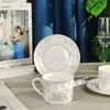 Taza y platillo de porcelana de hueso estilo europeo transfronterizo Serie Tigre Ruyi Juego para el hogar Taza de café y platillo Caja de regalo creativa para café de la tarde