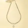 Europa y Estados Unidos diseño de moda transfronterizo sentido redondo colgante de marca collar personalidad femenina hip hop estilo punk cadena de clavícula para hombre venta al por mayor