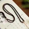 Cordão Pingente de Fio de Algodão Tecido à Mão Xizang Thangka Cordão de Tecelagem Artesanal Estilo Étnico Pingente de Jade Âmbar Cordão Colar Pendente