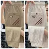 Pantalones Casuales de Trabajo 2025 para Hombre Verano Delgados de Seda de Hielo Secado Rápido Holgados Nuevos Color Caqui Deportivos de Nueve Puntos
