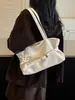 Colección de otoño 2026 transfronteriza: bolso de mano de diseño único, gran capacidad, moderno y casual, con una textura única y un diseño elegante, bolso de hombro para mujer