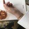 SL069 Pulseira estilo francês INS europeia e americana oval nariz de porco grão de café simples aço titânio banhado a ouro 18K proteção de cor