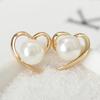 E1014 Versión coreana de aretes de perlas de amor de corazón aretes simples lisos aretes de temperamento Joker ventas directas de fábrica