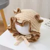 Bonitos y adorables gorros de otoño e invierno para niños, con diseño de poner, material de punto y una serie de dibujos animados, que brindan abrigo y protección para los oídos para bebés y niños pequeños.
