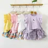 Conjunto de Verano para Niñas 2026 Nuevo Estilo Camiseta de Manga Acampanada para Niños Pantalones de Falda Floral Conjunto de Dos Piezas
