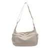 Bolsa de lona transfronteriza para mujer, nuevo modelo 2026, bolso de hombro casual versátil, bolso cruzado deportivo ligero de moda para el trabajo