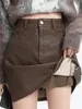 Design de saia Maillard de comprimento médio para mulheres, cor café, novo estilo outono/inverno 2026, saia curta preta de cintura alta em linha A A14195