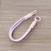 Correa de muñeca para teléfono, cordón antipérdida, cordón para llaves tejido de nailon, disponible en varios colores, accesorio para funda de teléfono
