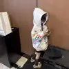 Sudadera con capucha para niños 2026 nuevo otoño e invierno estampado de graffiti de dibujos animados top casual elegante para niñas