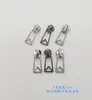 Cabeça de zíper de fábrica em estoque Não. 3 Não. 5 Não. Bolsa com zíper e puxador inferior de metal prateado brilhante com 8 pérolas