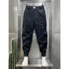 Pantalones pitillo cropped para hombre con cordón en el tobillo 2023 Verano nuevos con línea brillante overol personalizado pantalones tipo harén versátiles que estilizan