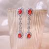 Pendientes largos con borlas y cristales de imitación de gemas rojas vibrantes transfronterizos de Europa y Estados Unidos, pendientes colgantes de novia para boda, venta al por mayor