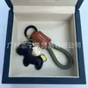 Dinero en el Caballo Cuero de Vaca Creativo Exquisito Casual Regalo de Pareja Bolso Lindo Colgante Llavero de Coche Llavero