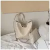 Bolsa tote com textura de trama cruzada feminina novo estilo casual grande capacidade para o dia a dia bolsa de ombro único bolsa de balde para o antebraço da moda tendência