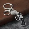 Chaveiro Pingente de Bolsa Artesanal de Luxo Pequeno Presente Criativo Design de Pistola Revolver Exquisita com Pedras Strass