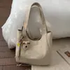 Bolsa Tote Casual Leve Estilo Coreano para Mulheres 2025 Novo Modelo Grande Capacidade Elegante Nicho Artístico Simples Bolsa de Ombro Transversal