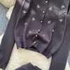 Atuendo de Estilo Elegante: Conjunto de Dos Piezas de Cárdigan y Falda Tejidos Fuertemente Bordados para Mujer, Traje Nuevo de Otoño 2026 para el Trabajo
