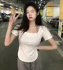 Verano 2023 Nuevo Top para Niña Ajustado Ajuste Ceñido Estilo Puro Deseo Cuello en U Grande Irregular de Manga Corta Camiseta para Mujer ins