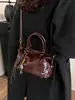 Bolso de mano vintage de alta costura tipo bolsa de almohada para mujer, nuevo bolso de hombro de moda otoño e invierno 2025, bolso cruzado versátil para el día a día