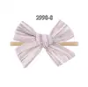 Bestseller transfronteiriço: Faixa de cabelo elástica de nylon fofa para bebê com laço grande, acessório de cabelo para bebê estampado em cor sólida 2998