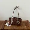 Bolsa de Ombro Poá Ruien para Mulheres Outono 2026 Nova Bolsa de Axila Moda de Nicho Bolsa de Mão Estilo Doce Simples