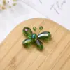 Comercio exterior cuentas de cristal pequeña mariposa color mariposa inteligente mariposa de cobre cristal mariposa diy pendientes pasador accesorios