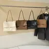 Coleção nova de outono de 2026 de grande capacidade: uma bolsa tote estilosa e versátil com um design único, oferecendo um visual sofisticado e minimalista, perfeita como bolsa de ombro