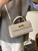 Bolsa Cuadrada Pequeña Kelly Nueva de Tejido Popular Portátil para Mujer Bolso Cruzado Versátil de Lujo Ligero Comercio Exterior Transfronterizo
