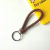 Llavero creativo de cuerda de cuero tejido a mano para pareja, llavero de coche, llavero al por mayor, colgante para bolso