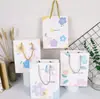 Bolsa de papel kraft grande ins pintura al óleo inglés exquisita bolsa de regalo caricatura linda bolsa de papel bolsa de mano para ropa al por mayor