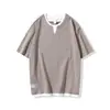 Camiseta de algodón de bambú texturizada de manga corta para hombre, nuevo estilo de verano, camiseta de imitación de dos piezas, corte holgado, cuello de doble capa, top de manga corta para hombre