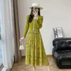 Vestido Plissado de Manga Longa Estilo Francês 2026 Nova Coleção Primavera e Outono Cintura Marcada Patchwork de Renda Falso Duas Peças Saia Plissada