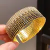 Pulsera elástica abierta circular con gradiente y adornos de diamantes, de diseño exquisito y moderno, un accesorio de lujo ligero y de alta gama