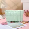 Bolsa de maquillaje de almacenamiento a la moda, bolsa nueva simple de textura de nicho, bolsa ligera, versión coreana para mujer, bolso de mano casual