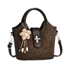 Bolso de mano de nicho de moda estilo coreano para mujer, nuevo bolso cubo casual de moda de verano 2026, bolso cruzado simple para el día a día