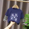 Camiseta de manga larga para niña, nuevo modelo primavera y otoño 2026, body falso de dos piezas para bebé, ropa infantil de algodón puro con rayas de dibujos animados