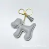 Colgante de Bolsa de Cachorro de Dibujos Animados Colgante Creativo para Llavero de Coche Parche para Funda de Teléfono Móvil de Cachorro Grande Colgante para Pulsera de Muñeca