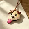 Encantador perrito peludo con la lengua fuera, llavero para bolso, colgante de dibujos animados natural, semillas de terapia de sonido curativas, popular en zonas escénicas, amuleto divertido y adorable