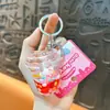 Chaveiros criativos de copo de milk tea em formato de coração com avião e animal pequeno preenchidos com óleo, pingentes de bolsa requintados e fofos, pequenos presentes atacado