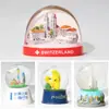 Fabricante Bola de Cristal de Resina Personalizada Edificio Monumento de Ciudad Personaje de Santa Claus Personaje de Anime Bola de Nieve Regalo Creativo