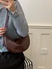 Bolso tipo dumpling simple y elegante de color sólido para mujer, nuevo bolso de mano Otoño 2026, bolso versátil de hombro y cruzado